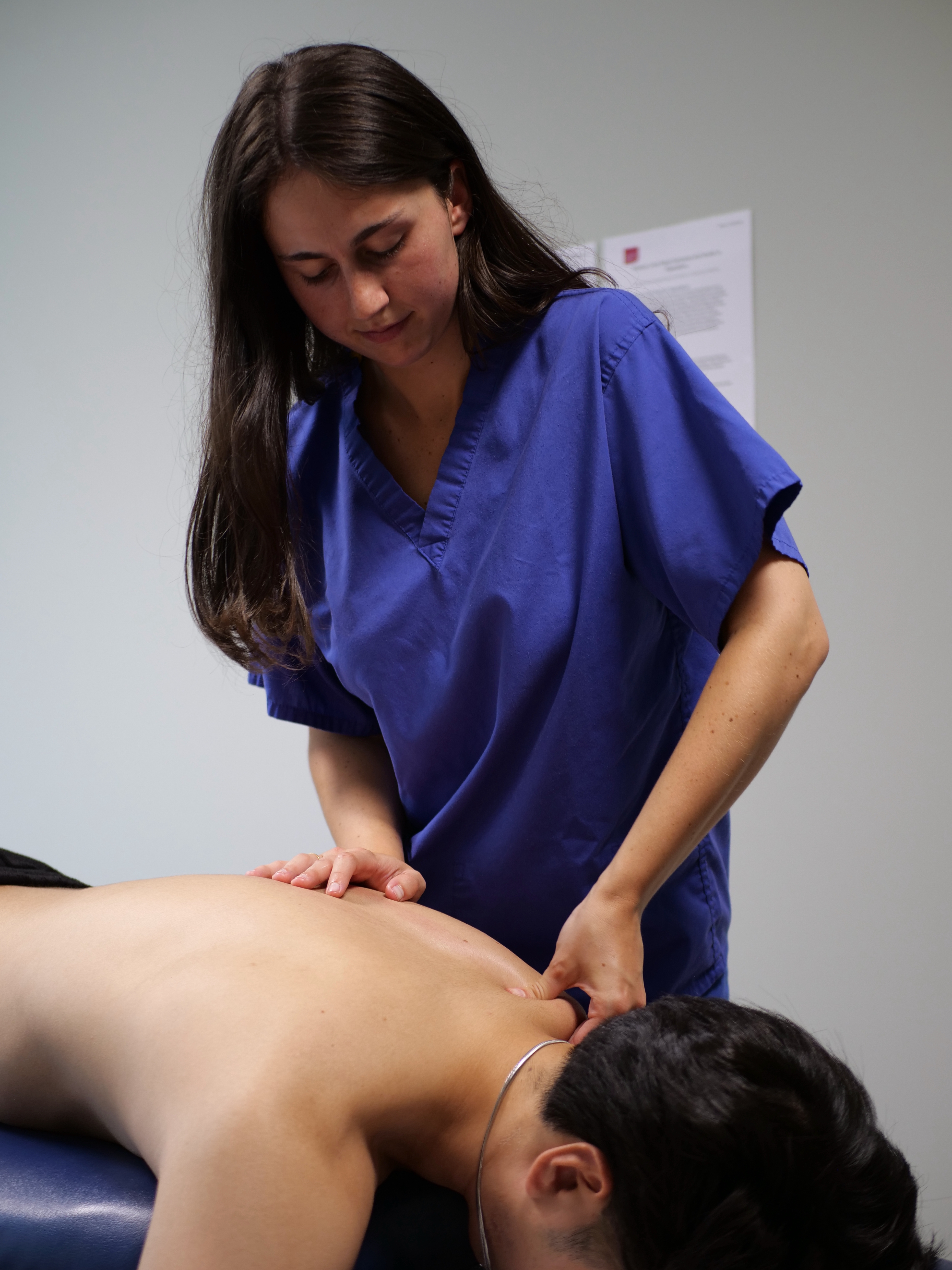 Dr. Vanderhaegen performing a spinal adjustment on a patient